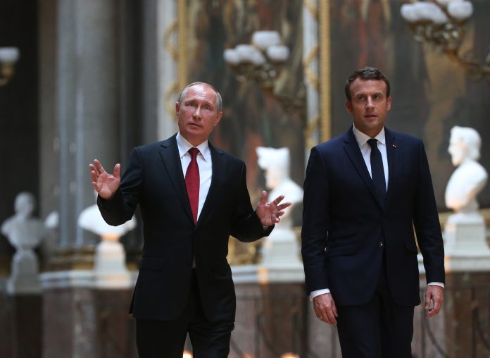 French President Emmanuel Macron receives Russian President Vladimir Putin in Versailles